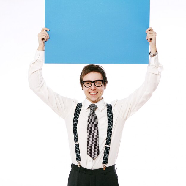 Stylish businessman with empty billboard