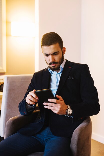 Stylish businessman with tablet