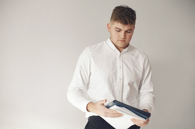 Stylish businessman working in a office and use the phone