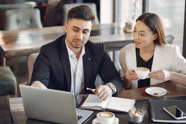 Stylish businessman working in a office and use the phone