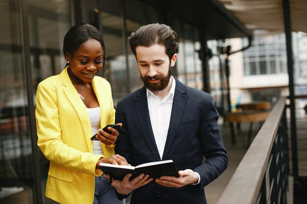 Stylish businessman working in a office with partner