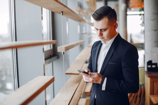 Free photo stylish businessman working in a office