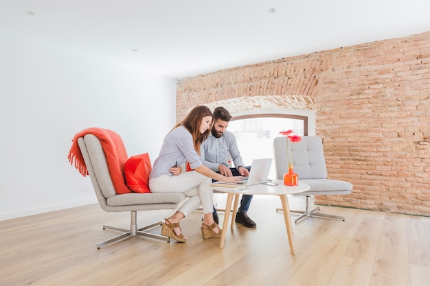 Free photo stylish businesspeople communicating in office