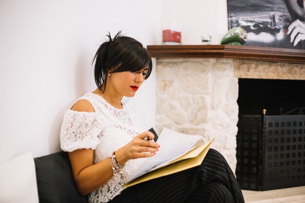 Stylish businesswoman concentrated on papers