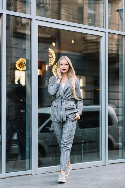 Free photo stylish businesswoman making phone call