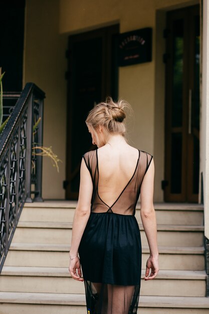 stylish businesswoman walking an posing