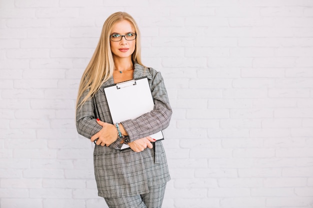 Stylish businesswoman with clipboard