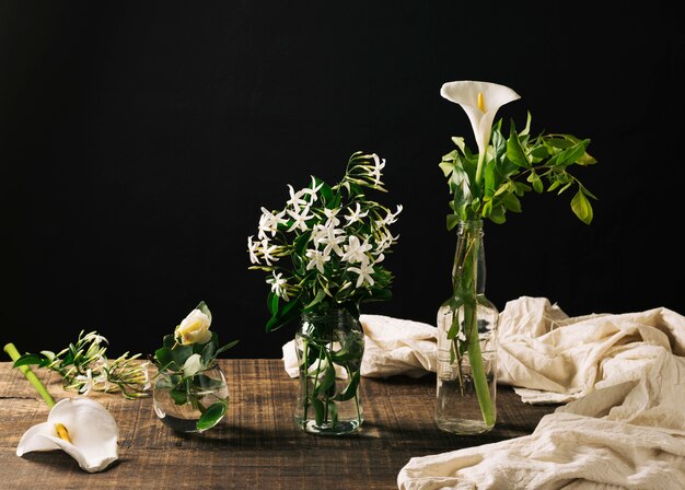 Stylish composition of flowers in glass 