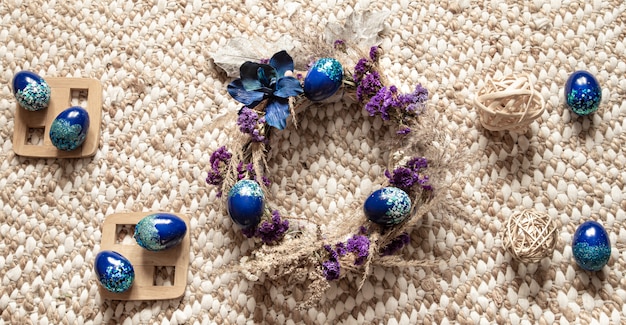 Free photo stylish composition with an easter wreath and eggs trend blue.