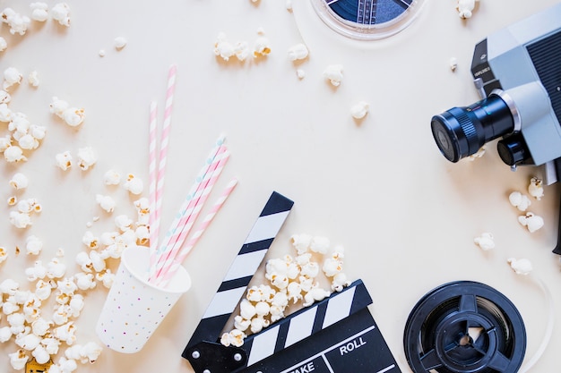 Stylish composition with popcorn and camera