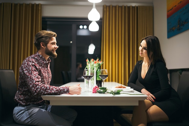 Stylish couple enjoying dinner