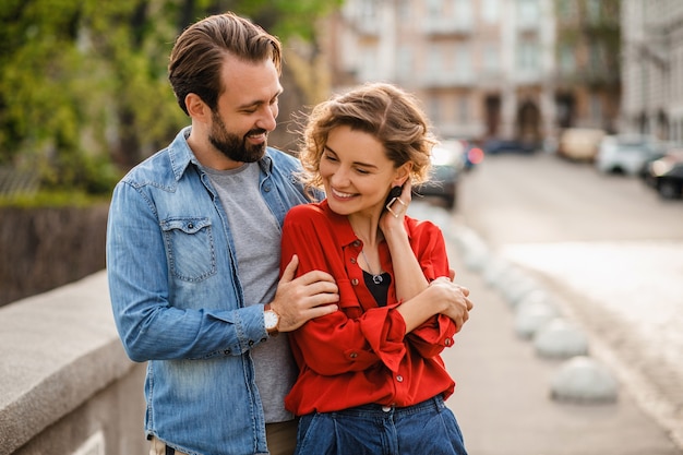 Free photo stylish couple in love sitting in street on romantic trip
