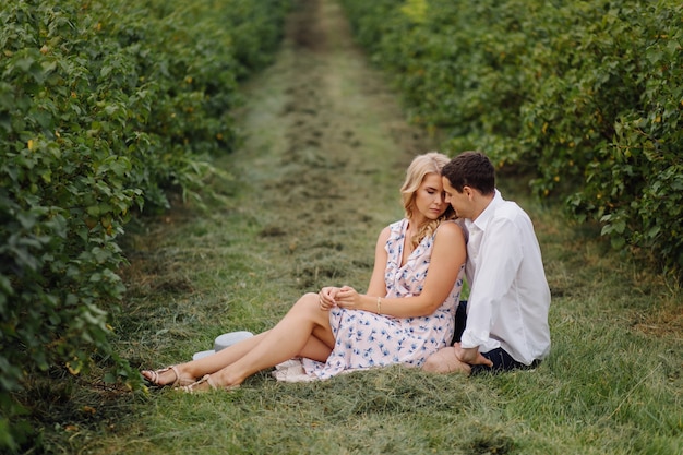 Stylish couple posing in the nature. Love and hugs