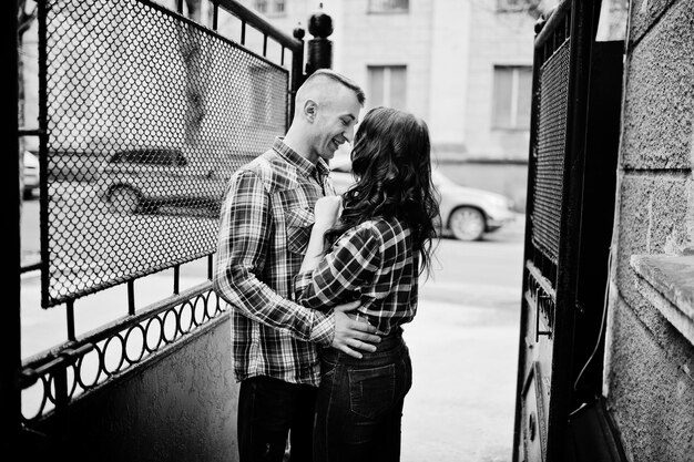 Stylish couple wear on checkered shirt in love together