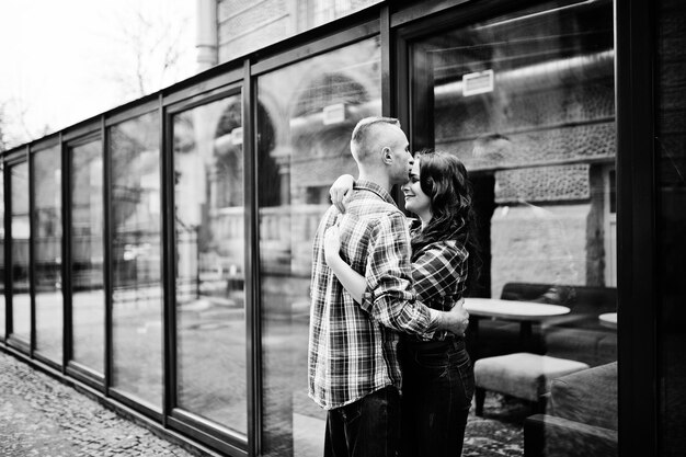 Stylish couple wear on checkered shirt in love together