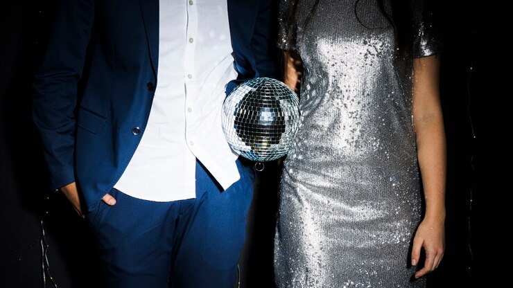 Free Photo stylish couple with disco ball