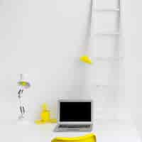 Free photo stylish desktop in white color with yellow details