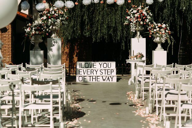 Stylish elegant white wedding aisle, chairs &amp; stairs