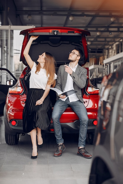 Stylish and elegant woman in a car salon