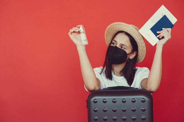 stylish girl posing with travel equipment red wall 1157 34340.jpg?size=626&ext=jpg&ga=GA1.2.1796391982 - 6 Persiapan Sebelum Wisata ke Malaysia, Catat dengan Baik