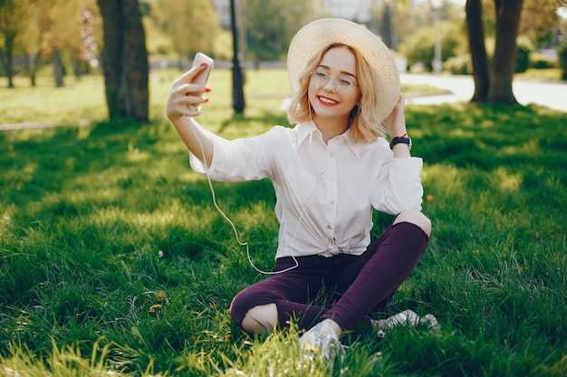 stylish girl standing in a park