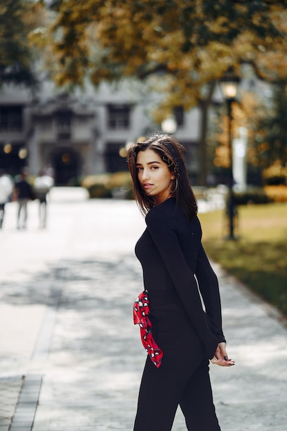 stylish girl walking through her school's campus