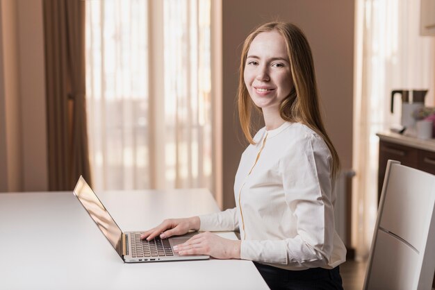 Stylish happy girl with laptop