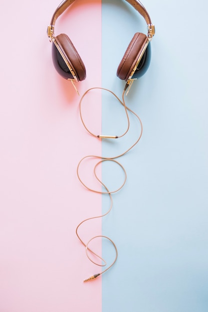 Stylish headphones on light background
