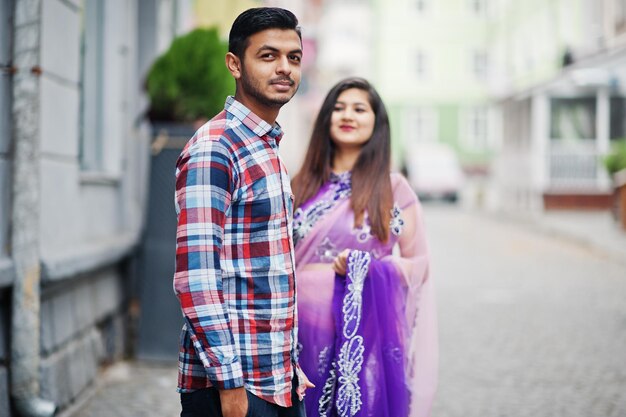 Stylish indian hindu couple posed on street