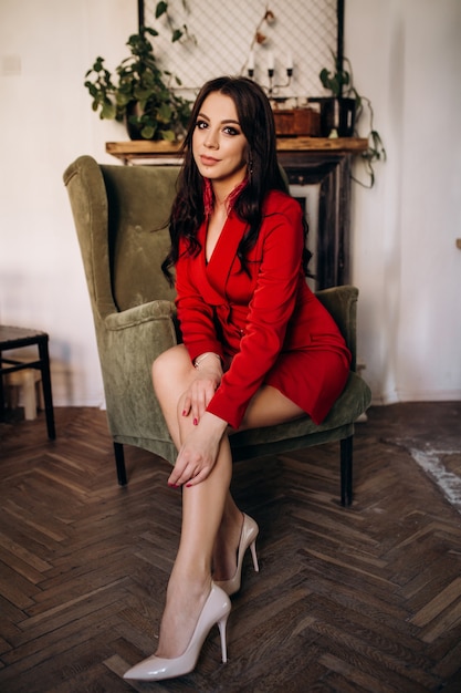 The stylish lady sitting on the chair