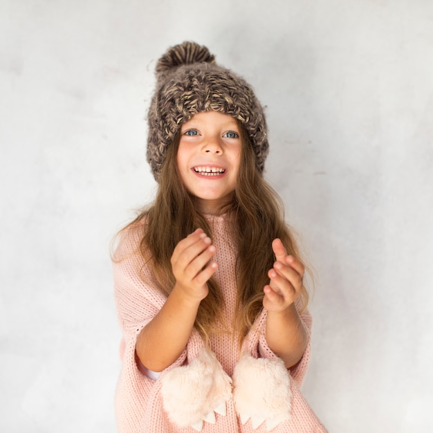 Stylish little girl looking at photographer