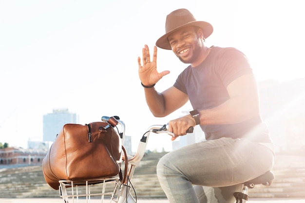 Stylish man posing on a bicycle