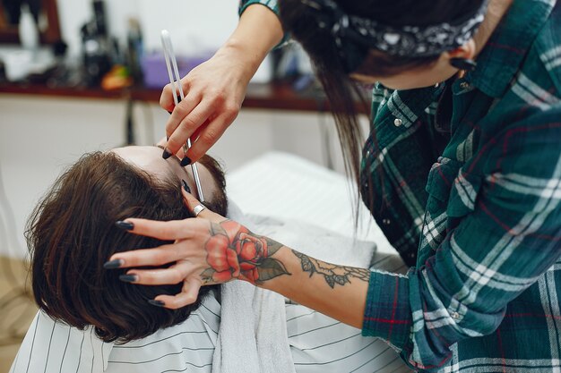 Stylish man sitting in a barbershop