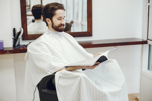 Stylish man sitting in a barbershop