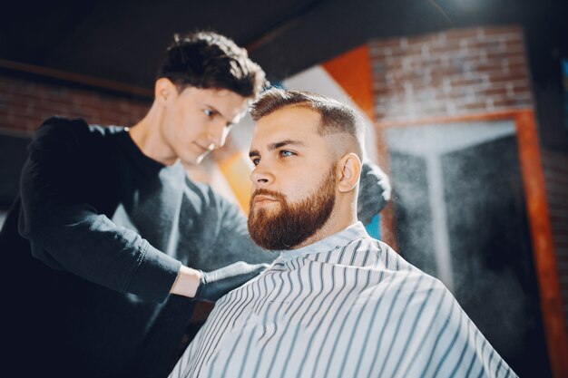 Stylish man sitting in a barbershop