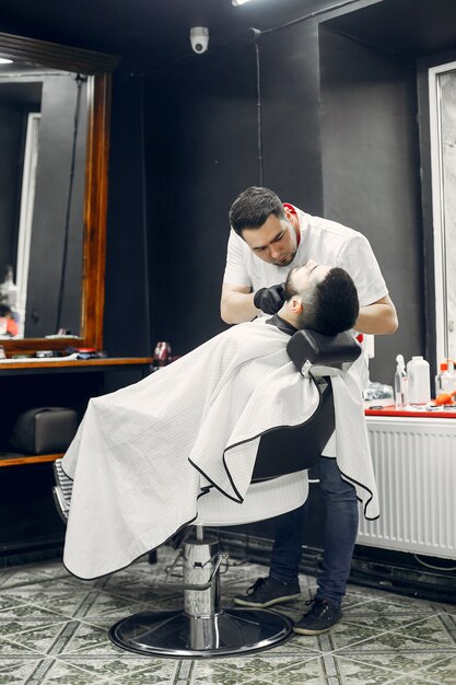 Stylish man sitting in a barbershop