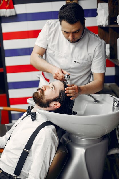 Stylish man sitting in a barbershop