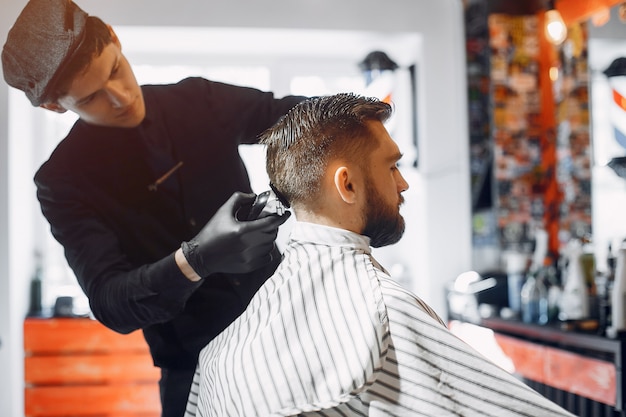 Stylish man sitting in a barbershop