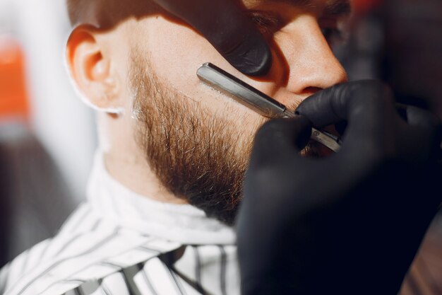 Stylish man sitting in a barbershop