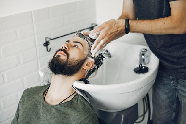 Stylish man sitting in a barbershop