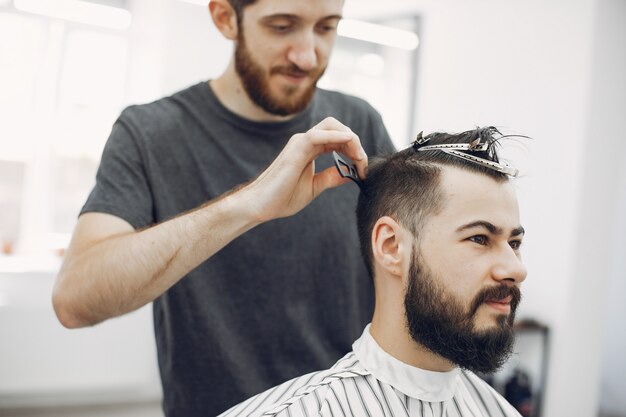 Stylish man sitting in a barbershop