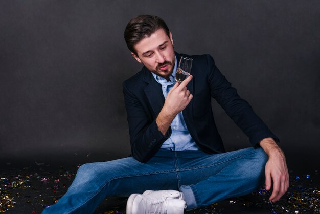 Stylish man with glass of drink