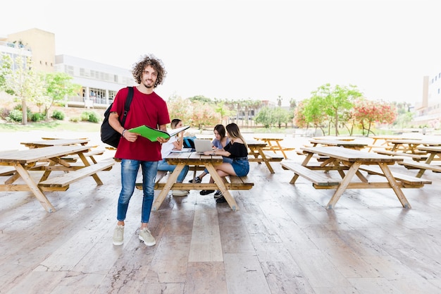 Stylish man with opened textbook