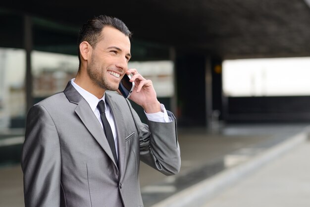 Stylish manager with mobile phone