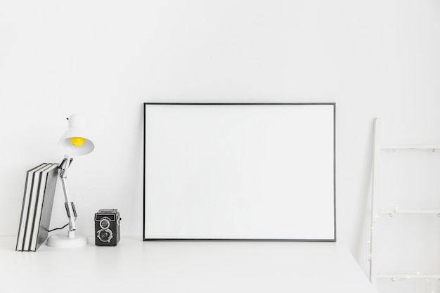 Stylish minimalistic workplace in white color with whiteboard