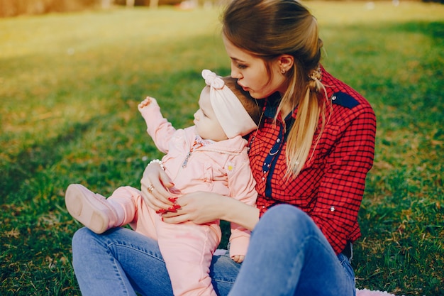 stylish mother with little daughter