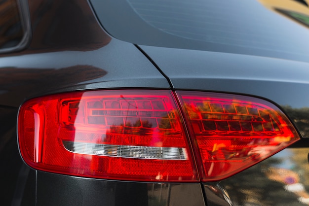 Stylish rear light on new black automobile