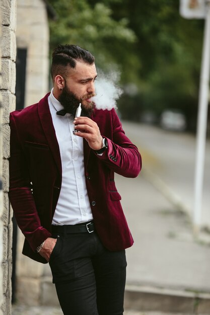 Stylish relaxed man smoking