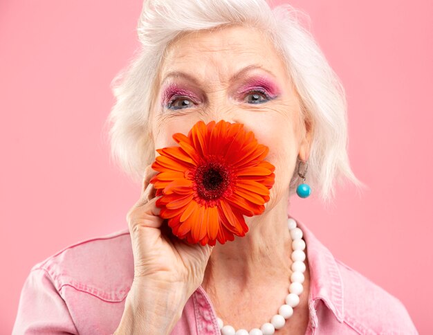 Stylish senior woman in pink