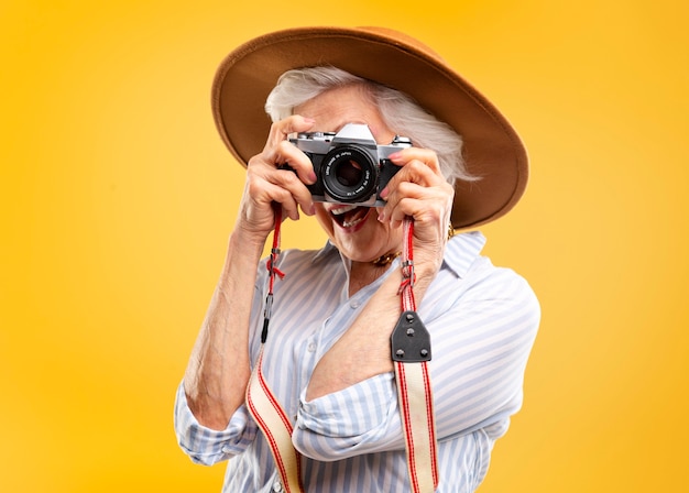 Free photo stylish senior woman posing